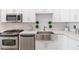 Modern farmhouse kitchen sink with white cabinets and subway tile at 150 E Robinson St # 1709, Orlando, FL 32801