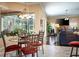 Dining area with a view, lots of light, and easy access to the living spaces at 11602 Graces Way, Clermont, FL 34711