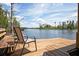 Enjoy stunning lake views from the private dock with comfortable seating and a serene atmosphere at 11602 Graces Way, Clermont, FL 34711