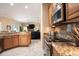 Spacious kitchen featuring granite countertops, stainless steel appliances, and tile flooring at 11602 Graces Way, Clermont, FL 34711