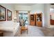 Bright living room with neutral carpet, glass sliding doors, and plenty of space for entertaining guests at 11602 Graces Way, Clermont, FL 34711