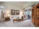 Bright living room with neutral carpet, glass sliding doors, and plenty of space for entertaining guests at 11602 Graces Way, Clermont, FL 34711