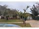 One-story house with stone accents and mature landscaping at 613 Pearl Rd, Winter Springs, FL 32708