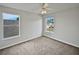 Bedroom with neutral decor, carpet flooring, and large window at 340 Troon Cir, Davenport, FL 33897