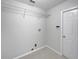 Laundry room with built-in shelving and a door at 340 Troon Cir, Davenport, FL 33897