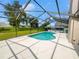 Inviting kidney-shaped pool with screened enclosure at 340 Troon Cir, Davenport, FL 33897