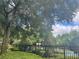 Relaxing community pool area partially visible through trees at 6100 Stevenson Dr # 207, Orlando, FL 32835