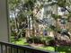 Partial view of condo building with lush landscaping at 6100 Stevenson Dr # 207, Orlando, FL 32835
