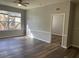 Bright living room with wood-look floors and neutral walls at 6100 Stevenson Dr # 207, Orlando, FL 32835