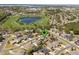 Aerial view of home near walking trails, with a nearby pond, walking trails, and community parks at 2855 Gopherwood Way, Clermont, FL 34711