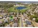 An aerial view of the community highlighting walking trails and a beautiful pond at 2855 Gopherwood Way, Clermont, FL 34711