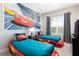 ' bedroom with twin beds featuring a Cars-themed mural at 7532 Sunville Ave, Kissimmee, FL 34747