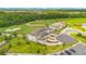 Beautiful aerial view shows the homes and community near lush golf course at 880 Driving Range Ct, Reunion, FL 34747