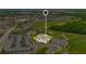 Stunning aerial view of a sprawling residential community featuring a golf course and elegant homes at 880 Driving Range Ct, Reunion, FL 34747