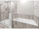 Bathroom with a soaking tub and a walk-in shower at 880 Driving Range Ct, Reunion, FL 34747