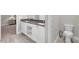 Double vanity bathroom with toilet and modern design at 880 Driving Range Ct, Reunion, FL 34747