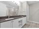 Double vanity bathroom with a large shower and modern finishes at 880 Driving Range Ct, Reunion, FL 34747