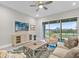 Living room with modern furniture, blue area rug, and sliding glass doors to patio at 880 Driving Range Ct, Reunion, FL 34747