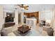 Bright and airy open-concept living space featuring modern furniture and seamlessly integrated kitchen and dining areas at 2748 Clinton Heights Ct, Oviedo, FL 32765