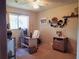 Bedroom featuring neutral colored walls, office space and natural light at 3455 Jujube Dr, Orlando, FL 32810