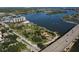 Panoramic aerial view showcasing the waterfront condo, green spaces, and bridge at 101 N Riverside Dr # 4100, New Smyrna Beach, FL 32168