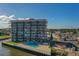 Condo building with water view, pool deck and parking at 101 N Riverside Dr # 4100, New Smyrna Beach, FL 32168