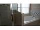 Spa-like bathroom with soaking tub and walk-in shower at 124 Lancaster Dr, Davenport, FL 33897