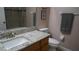 Clean bathroom with granite countertop, single sink, and shower/tub combo at 124 Lancaster Dr, Davenport, FL 33897