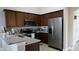 Modern kitchen with stainless steel appliances and granite countertops at 124 Lancaster Dr, Davenport, FL 33897