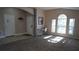 Bright living room featuring carpet flooring and large windows at 124 Lancaster Dr, Davenport, FL 33897