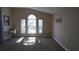 Spacious living room with large windows, great natural light at 124 Lancaster Dr, Davenport, FL 33897