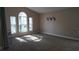 Bright living room with vaulted ceilings and large windows at 124 Lancaster Dr, Davenport, FL 33897