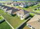 Areal view of the backyard featuring a well-maintained lawn in quiet residential neighborhood at 5043 Sw 88Th Pl, Ocala, FL 34476