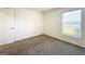 Bright bedroom featuring neutral walls and carpeted floors at 5043 Sw 88Th Pl, Ocala, FL 34476