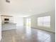 Bright living room with tile floors and sliding glass doors leading to the backyard at 5043 Sw 88Th Pl, Ocala, FL 34476