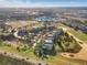 Aerial view showing community buildings and golf course at 748 Desert Mountain Ct, Reunion, FL 34747