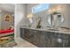 Modern bathroom with double vanity and elegant mirrors at 748 Desert Mountain Ct, Reunion, FL 34747