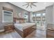 Elegant Primary bedroom with a king-size bed and large windows at 748 Desert Mountain Ct, Reunion, FL 34747