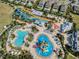 Aerial view of community pool and water park at 748 Desert Mountain Ct, Reunion, FL 34747