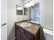 Bathroom vanity with a sink and mirror, plus a view to the bedroom at 4367 Thornbriar Ln # 108, Orlando, FL 32822