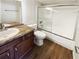 Clean bathroom featuring a vanity, toilet, and a shower with glass doors, and wood floors at 4367 Thornbriar Ln # 108, Orlando, FL 32822