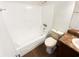 Bathroom featuring tile flooring, white tub and tiled walls at 4367 Thornbriar Ln # 108, Orlando, FL 32822
