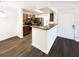 Kitchen with a breakfast bar and stainless steel appliances at 4367 Thornbriar Ln # 108, Orlando, FL 32822