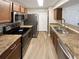 Modern kitchen featuring stainless steel appliances, sleek countertops, and ample cabinet space for storage at 4367 Thornbriar Ln # 108, Orlando, FL 32822