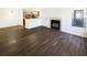 Open-concept living room with fireplace and access to kitchen and dining at 4367 Thornbriar Ln # 108, Orlando, FL 32822