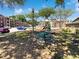 Community playground with a picnic table and apartment buildings in the background at 4367 Thornbriar Ln # 108, Orlando, FL 32822