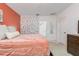 Main bedroom with coral and stone pattern walls, and ample closet space at 122 Blue Cypress Drive, Davenport, FL 33837