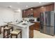 Well-equipped kitchen featuring stainless steel appliances and granite countertops at 122 Blue Cypress Drive, Davenport, FL 33837