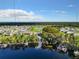 Beautiful aerial view of the lakefront community, featuring a private boat dock and lush landscaping at 4234 Sunset Preserve Blvd, Orlando, FL 32820