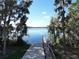 Scenic view of the lake through trees from dock at 4234 Sunset Preserve Blvd, Orlando, FL 32820